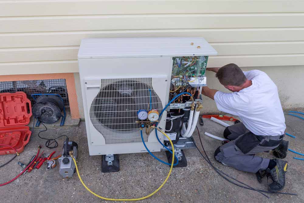 HVAC contractor working on heating system Amarillo, TX